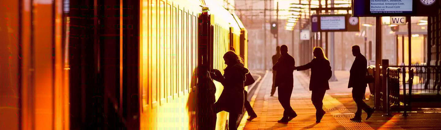 People boarding a train in the morning