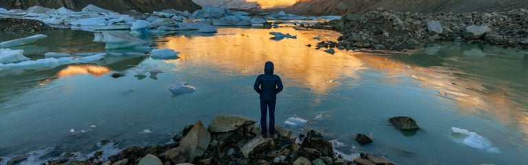 Person standing by the lake