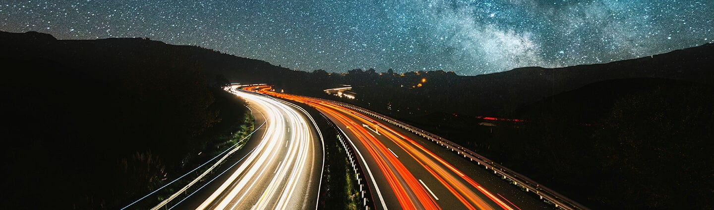 Road at night and starry sky