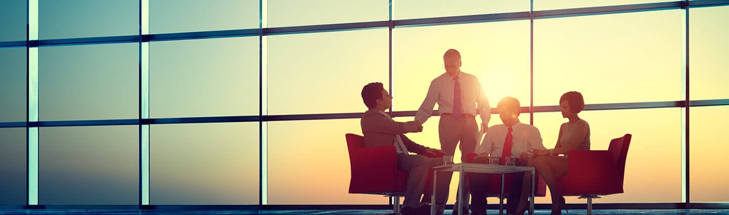 Group of people sitting at the table at a meeting