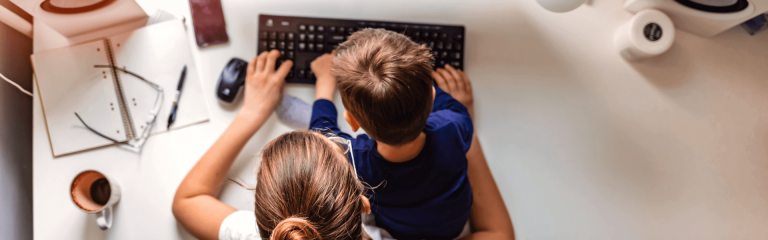 Woman and boy working together in home office
