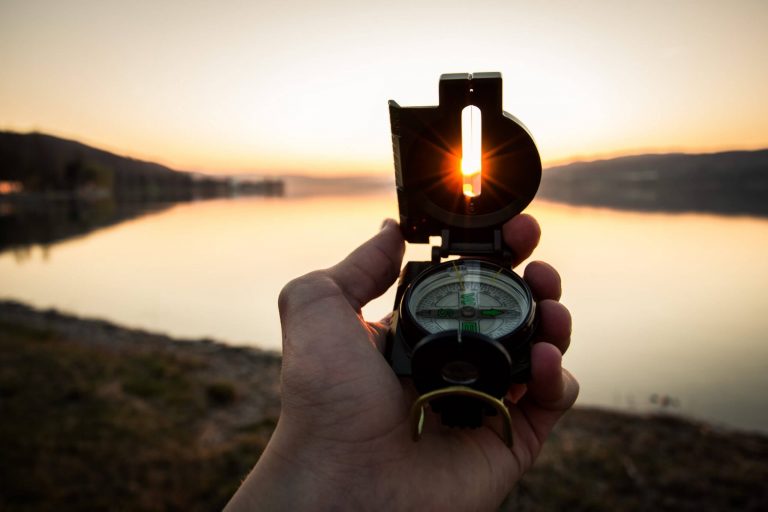 Sunset horizon with compass