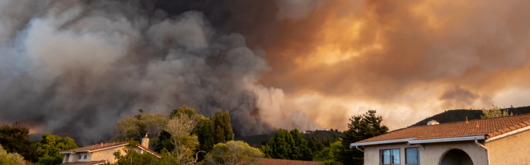 Flaming hills behind the houses