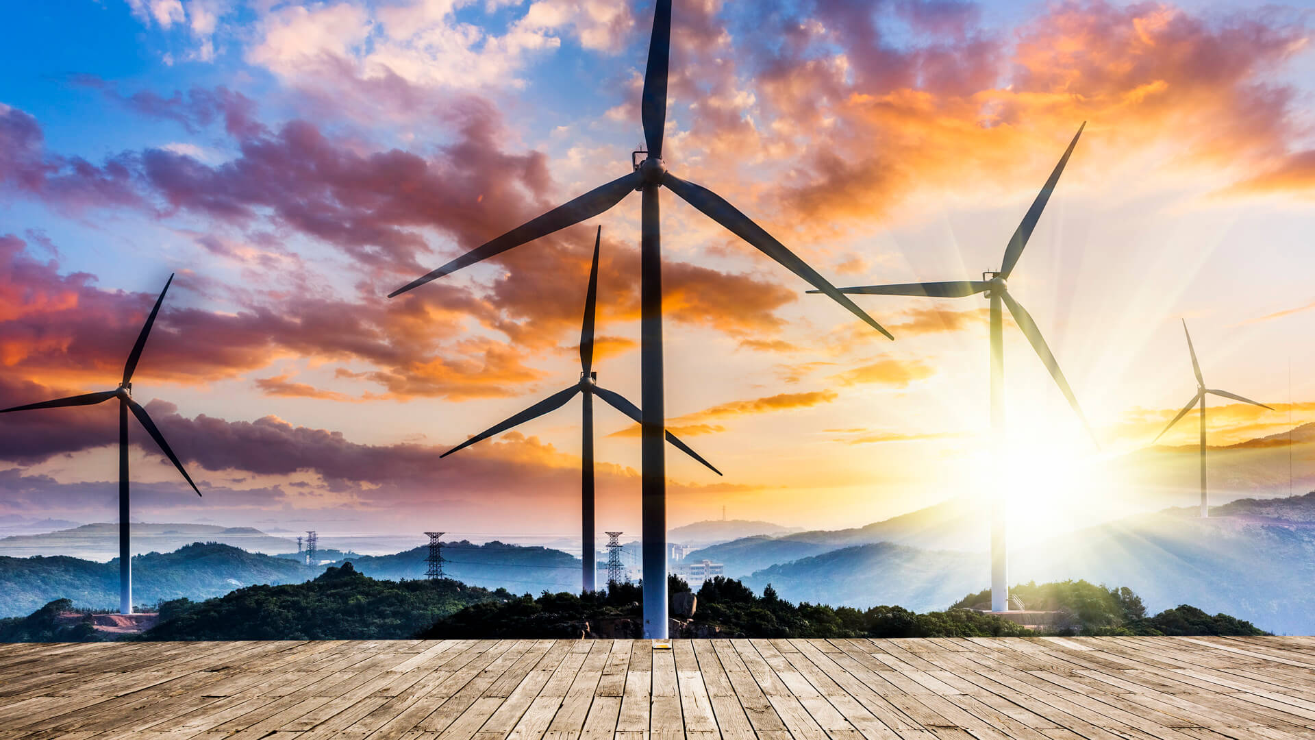 View of a wind farm producing energy in the sun