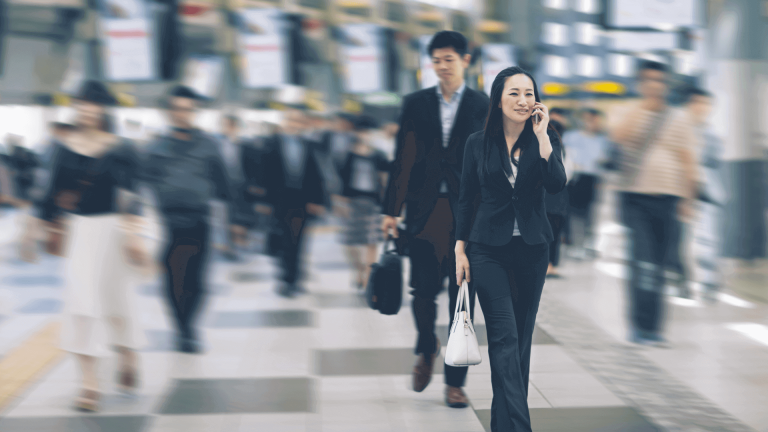 Woman talking on the phone in a crowd of people