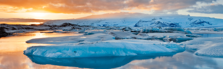 Ice floe in the ocean at sunset