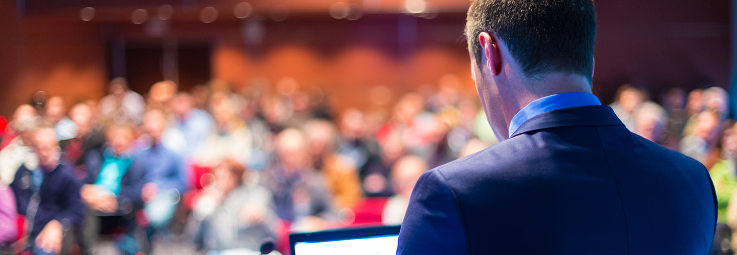 Man at lectern