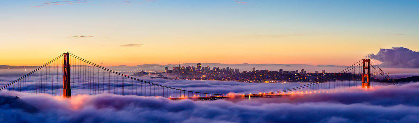 Large bridge surrounded by fog against the backdrop of the city