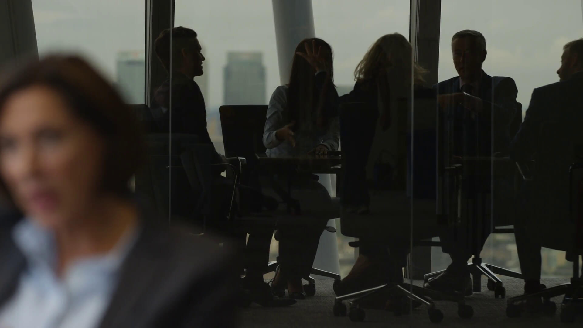 Team meeting in a glass room