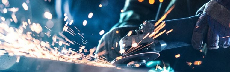 Man working with angle saw