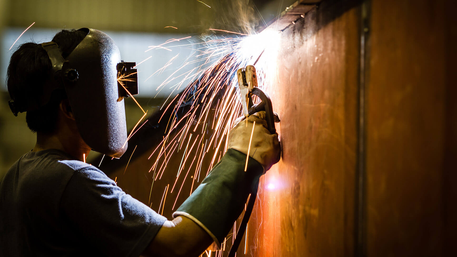 Metal Worker with Protective Mask