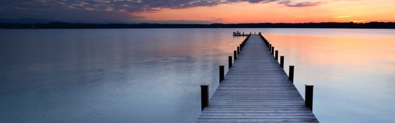 Pier on the lake at sunset