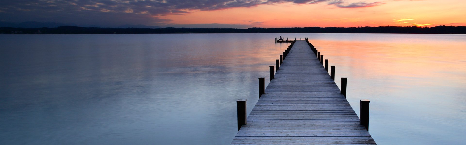 Pier on the lake at sunset