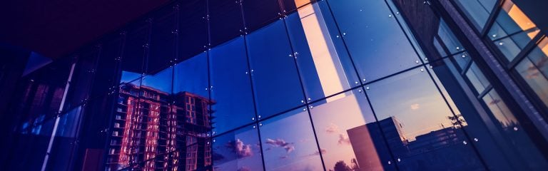 Buildings reflected in glass block