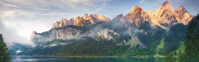 Illuminated mountains lake and forest