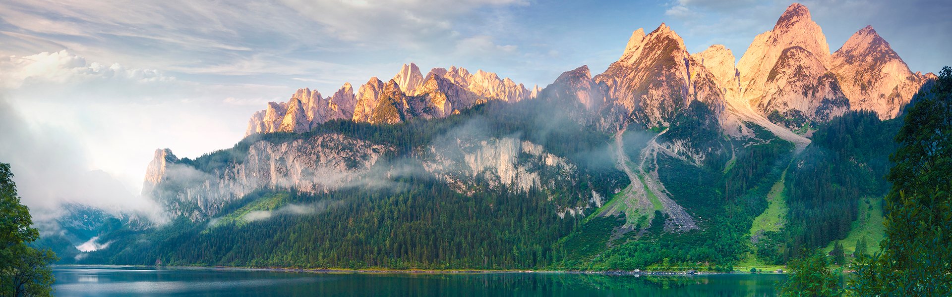 Illuminated mountains lake and forest