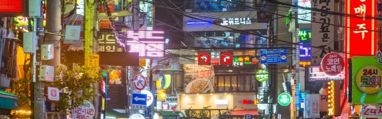 Image of the street in Hong Kong with many signs, banners etc.