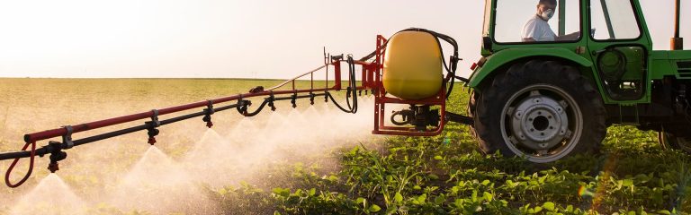 Fertilizing the field with a tractor