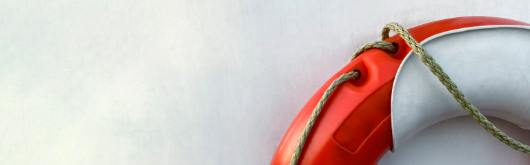Life buoy on white wall (front view)