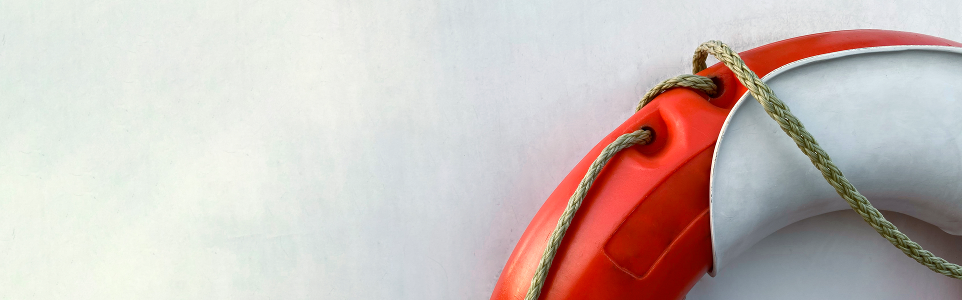 Life buoy on white wall (front view)