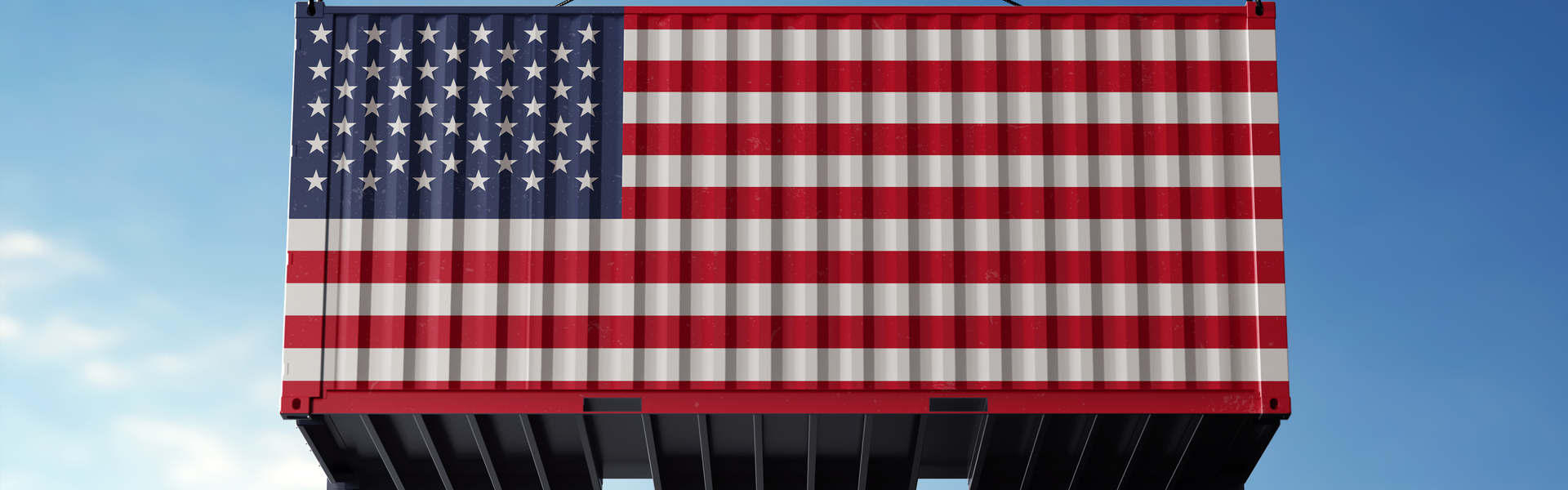 US flag on cargo container in front of sky