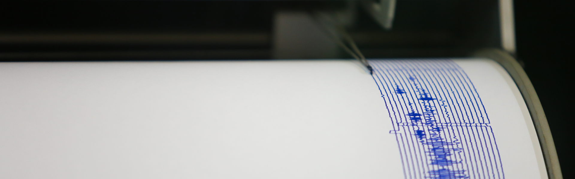 Seismograph pen scribbles an earthquake