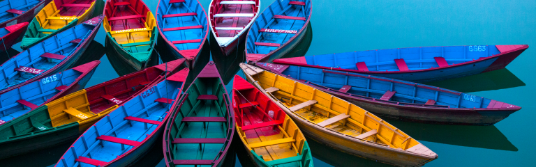 Colourful boats on calm water