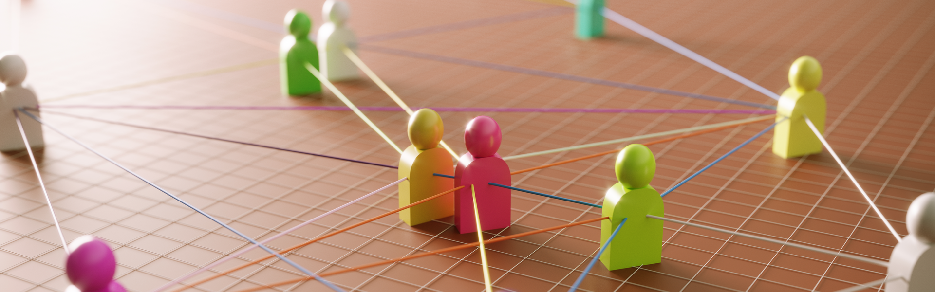 various colourful wooden figurines, tied together with string
