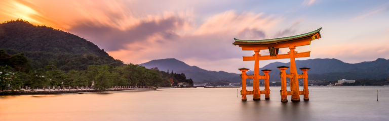 Large red 'floating' Torii gate in Japan at sunrise